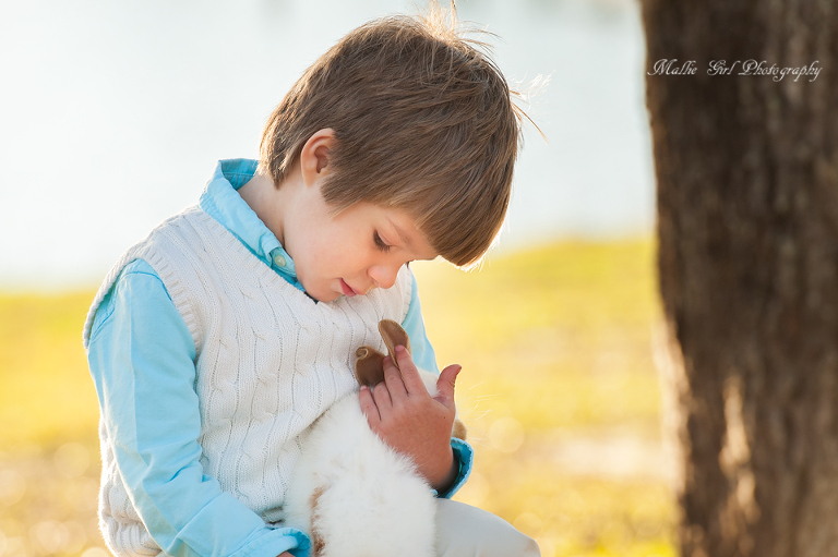 A sweet image of a boy and his bunny rabbit