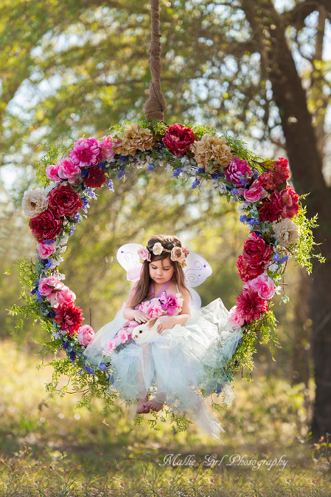 A Fairy on a Floral Swing in the Enchanted Forrest