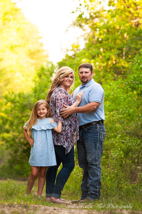 An outdoor pregnancy reveal family session